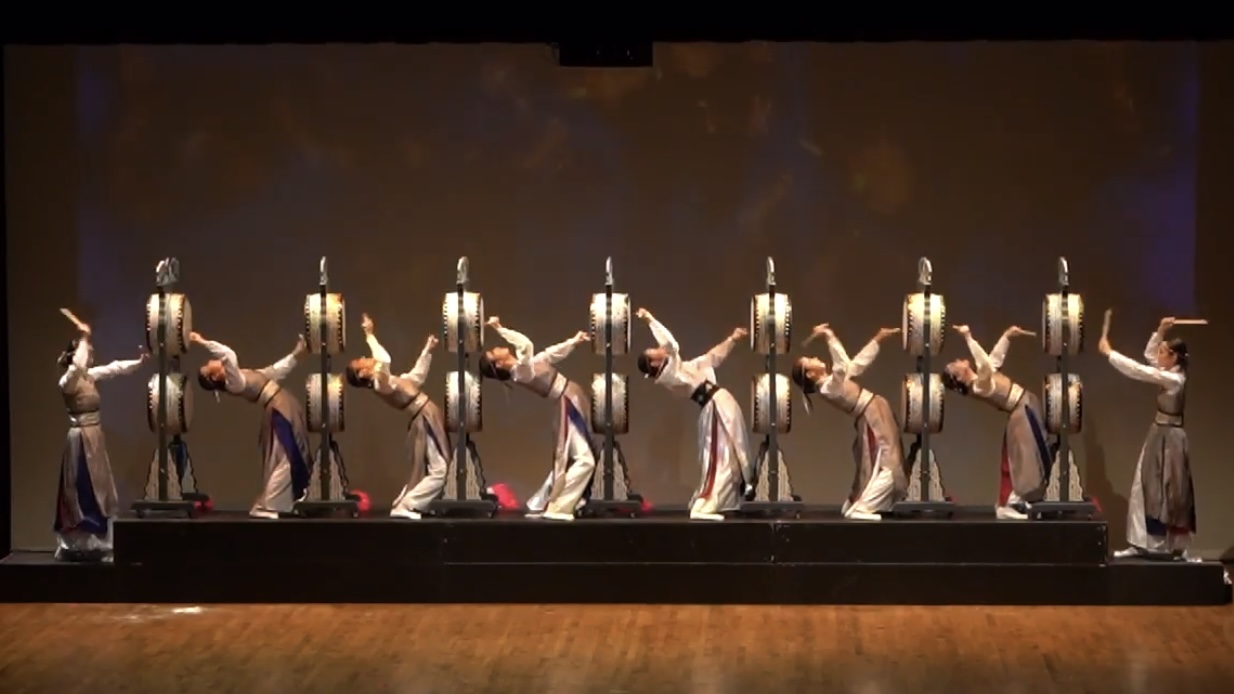 Traditional dance with drums in formation