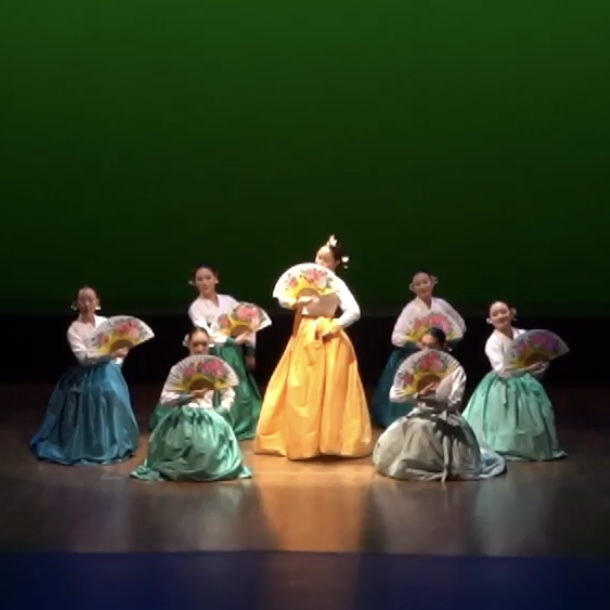 Fan dance ensemble in performance